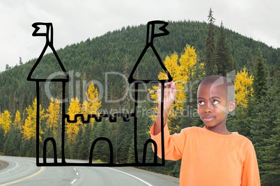 Boy drawing a castle on the road