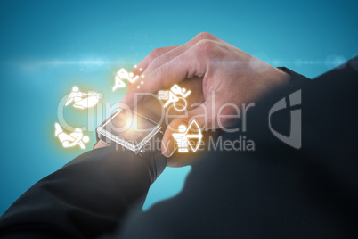 Composite image of businessman checking time