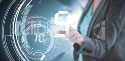 Composite image of businesswoman touching invisible digital screen