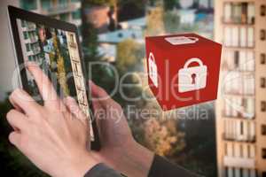 Composite image of close-up of businesswoman holding digital tablet