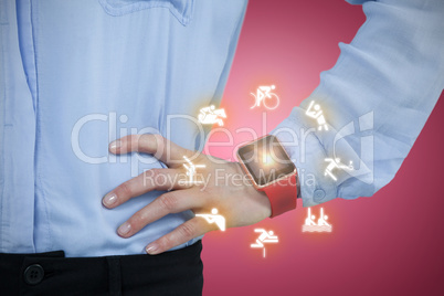 Composite image of midsection of businesswoman wearing smartwatch