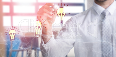 Composite image of mid section of businessman writing with marker