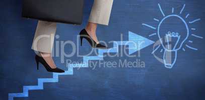 Composite image of low section of businesswoman climbing steps with briefcase