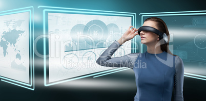 Composite image of woman wearing virtual reality glass