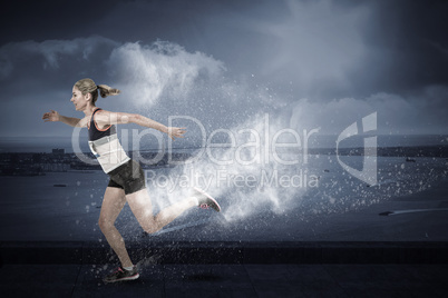 Composite image of female athlete running on white background