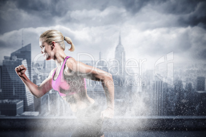 Composite image of muscular woman running in sportswear