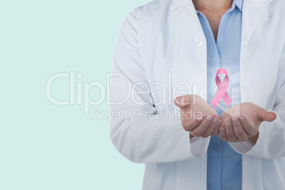 Composite image of midsection of female doctor standing with hands cupped