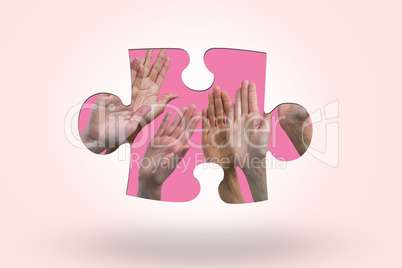 Composite image of multiethnic women raising their hands up