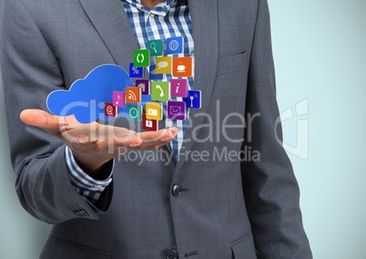 Business hand spread of with cloud and application icons. Light blue background