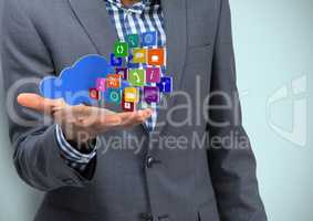 Business hand spread of with cloud and application icons. Light blue background
