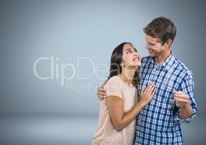 Couple Holding key in front of vignette