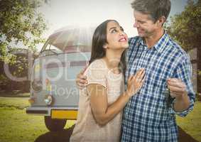 Couple  Holding key in front of camper van