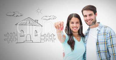 Couple Holding key with home drawing in front of vignette