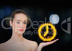 woman with hand up with clock fire icon over. Dark bokeh background.