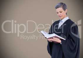 Female judge reading against brown background