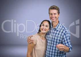 Couple Holding key in front of vignette