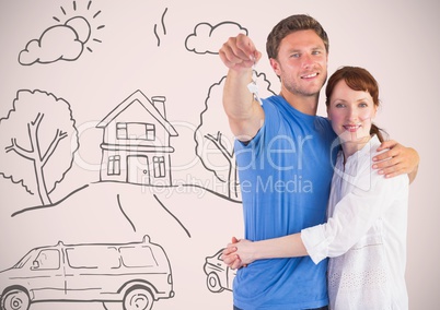 Couple Holding key with house home drawings in front of vignette