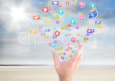 hand with application icons coming up from it on the beach