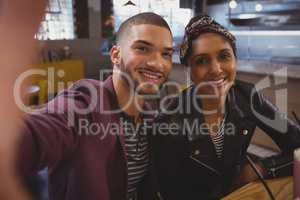 Portrait of happy friends in cafe