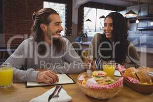 Friends having food in cafe