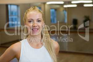 Portrait of happy female dancer in studio