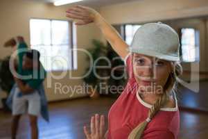 Portrait of female dancer with friend practicing