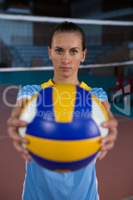 Portrait of female sportsperson holding volleyball