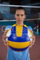 Portrait of female sportsperson holding volleyball