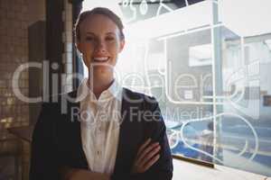 Portrait of confident owner in cafe