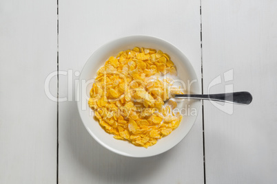 Breakfast cereals in bowl on a wooden table