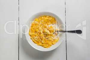 Breakfast cereals in bowl on a wooden table