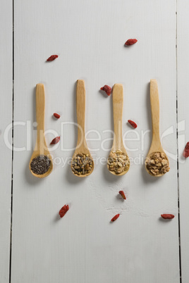 Various oatmeal in wooden spoon