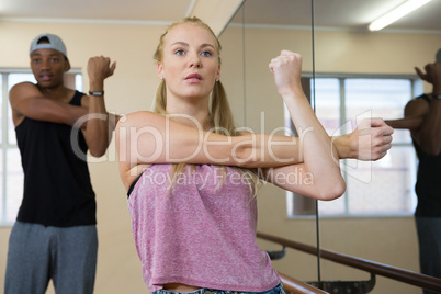 Female dancer with friend practicing