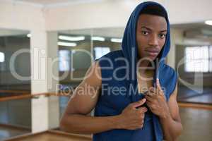 Portrait of male dancer in hooded shirt