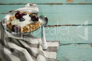 Bowls of breakfast cereals and fruits with yogurt