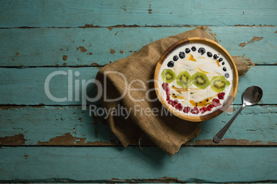 Yogurt and fruits in bowl