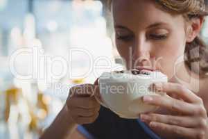 Close-up of woman drinking coffee