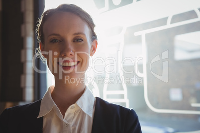 Portrait of happy owner in cafe