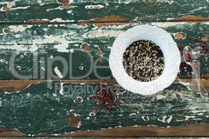 Mix peppercorns on wooden table