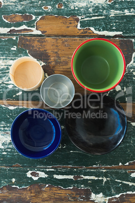 Various type of empty bowl on wooden table