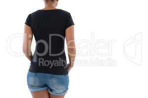 Rear view of young woman in hot pants