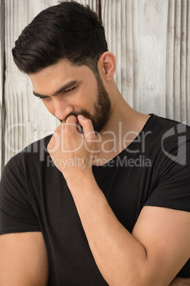 Man posing against wooden background