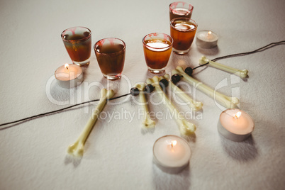 High angle view of drinks with candles and decoratio