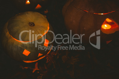 Jack o lantern glowing in darkroom during Halloween