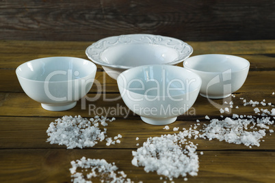 Bowls and sea salt scattered