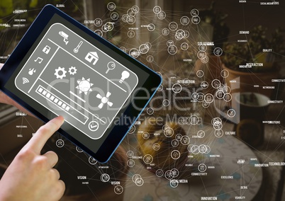 Hand holding tablet with smart home interface and connectors