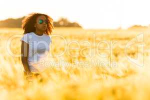 Mixed Race African American Girl Teen Sunglasses Standing Wheat