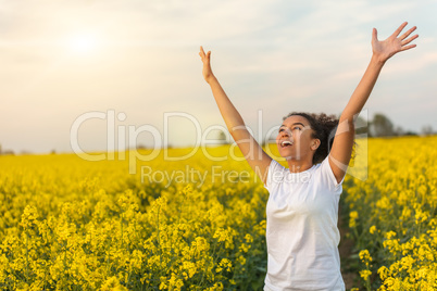 Mixed Race African American Girl Teenager Celebrating In Yellow