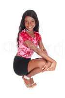 Beautiful African woman crouching