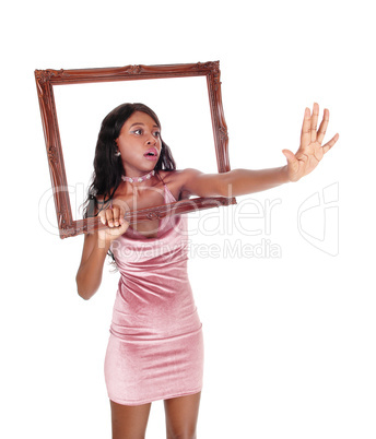 Scared woman reaching though frame
